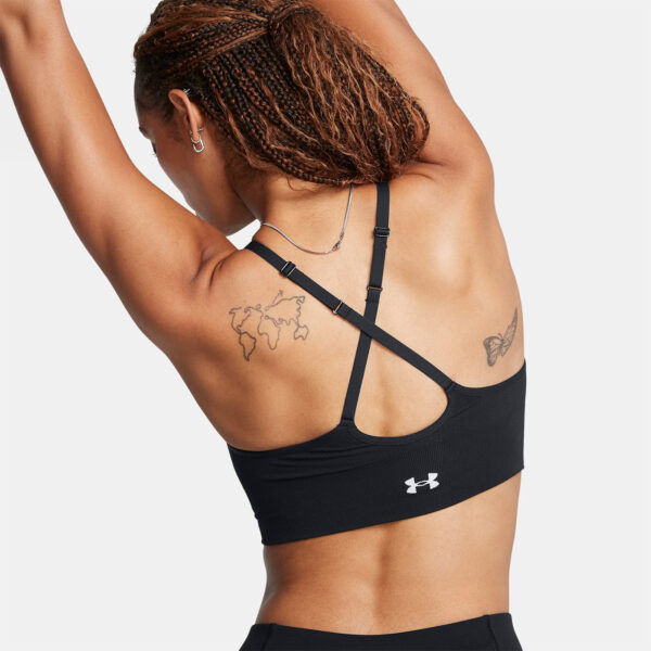 Brassière de sport noire et blanche à maintien léger UA Vanish Seamless pour femme 1384417-001 Vue porté de dos