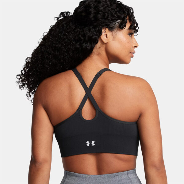 Brassière de sport noire et blanche à maintien léger UA Vanish Seamless pour femme 1384417-001 Vue porté de dos L