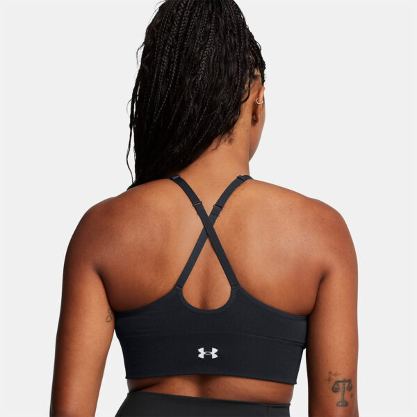 Brassière de sport noire et blanche à maintien léger UA Vanish Seamless pour femme 1384417-001 Vue porté de dos M