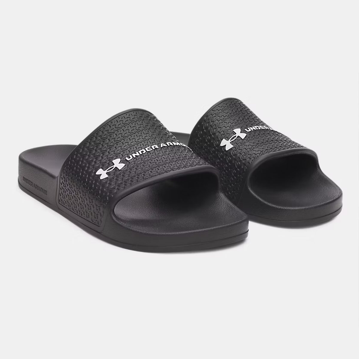 Claquettes UA ARMR Shower Under Armour Noires 6007528-001 Pair Lateral Front Top